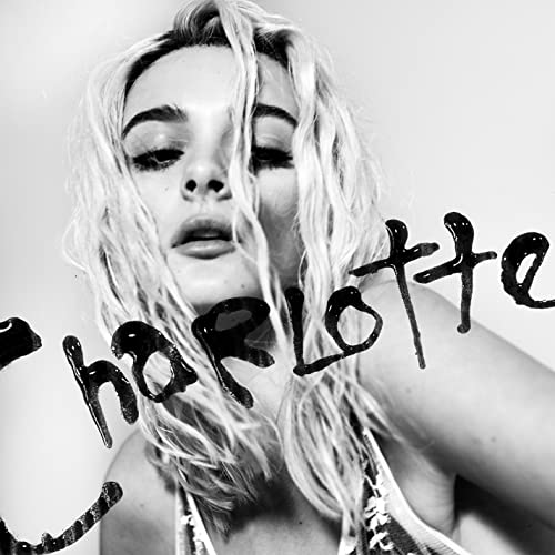Black and white portrait of Charlotte Lawrence with handwritten text.