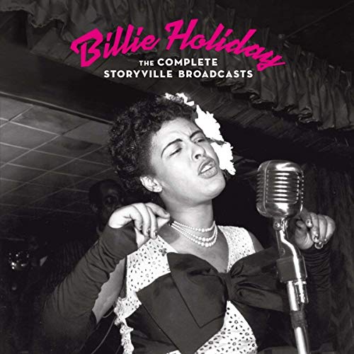 Billie Holiday singing into a vintage microphone, black and white photo.