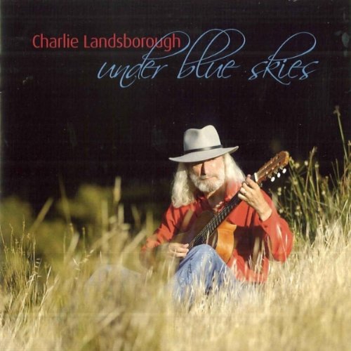 Charlie Landsborough sits in a field with a guitar, album cover.