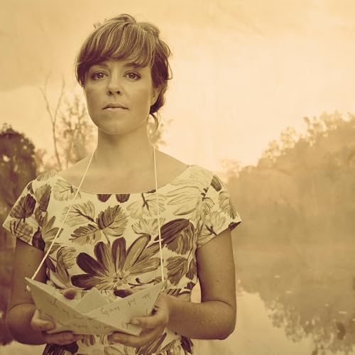 Woman in floral dress holding open envelope, sepia tone.