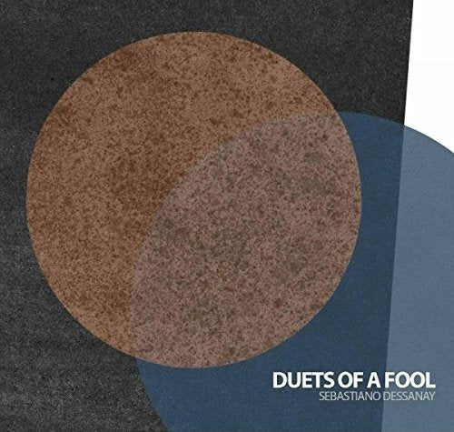 CD cover with abstract geometric shapes in brown, blue, and gray.