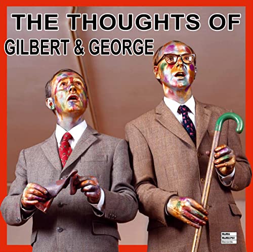 Two men with painted faces in suits, holding objects, against a red background.