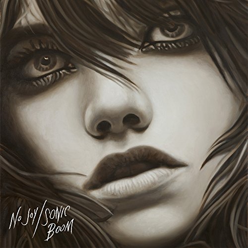 Close-up grayscale portrait of a person with intense eyes, album artwork.