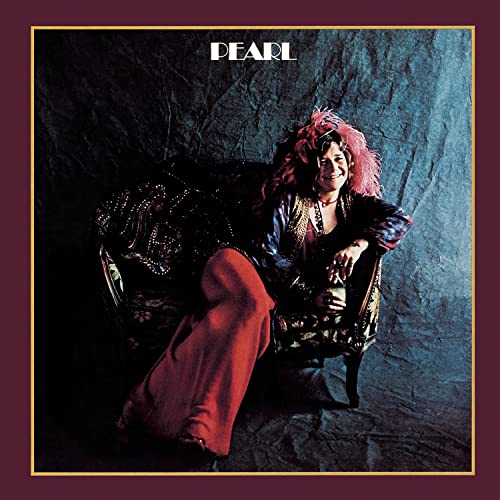 Janis Joplin album cover, "Pearl," showing her seated in a chair.