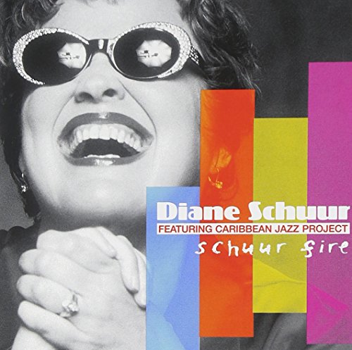 Diane Schuur album cover with a black and white portrait and colorful blocks.