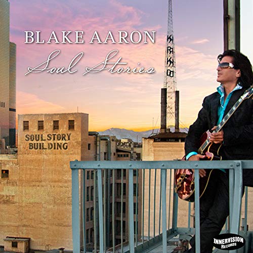CD cover: Blake Aaron with guitar, city skyline background.