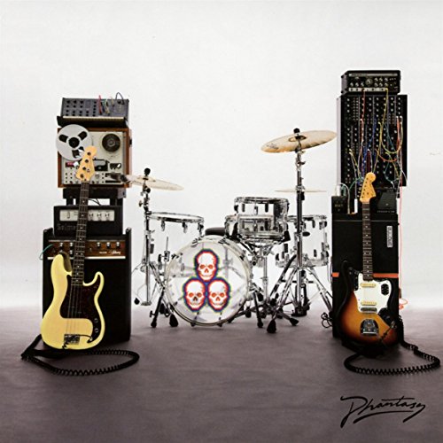 Electronic music instruments and a drum kit with skull designs.