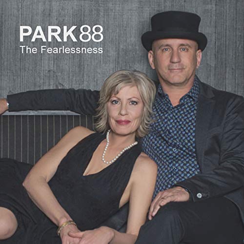 CD cover featuring a man in a hat and a woman in black.