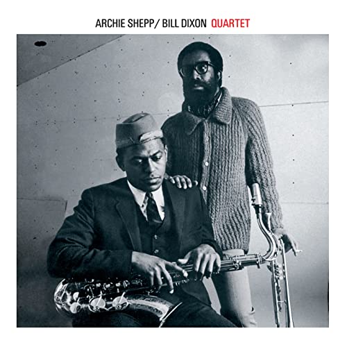 Black and white photo of two musicians with a saxophone, album cover.