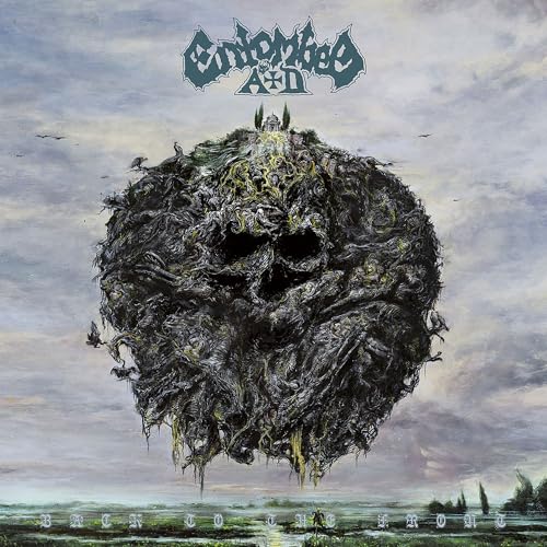 Album cover: detailed, dark skull-shaped landscape under a cloudy sky.