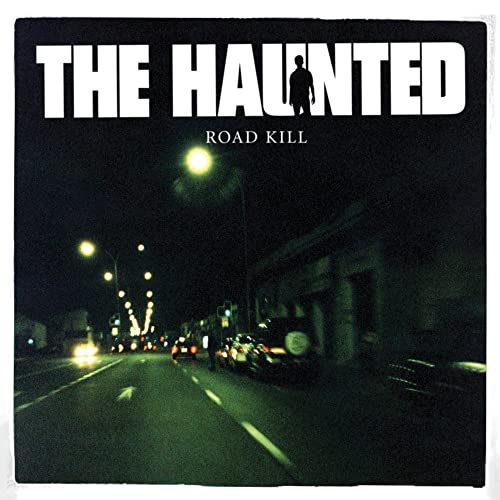 The Haunted" album cover: dark road scene with a lone figure.