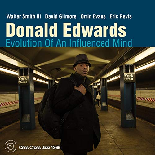 CD cover: Donald Edwards in a subway station, wearing a hat and coat.