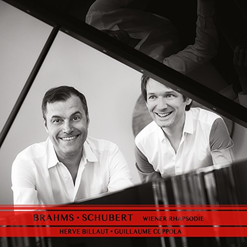 Black and white photo of two smiling men at a piano.