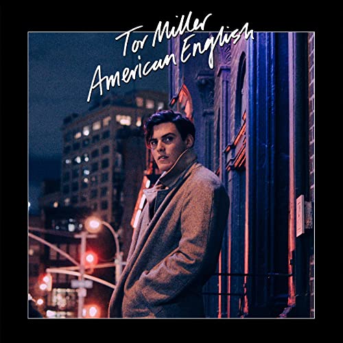 Tor Miller album cover: man in coat, city background.