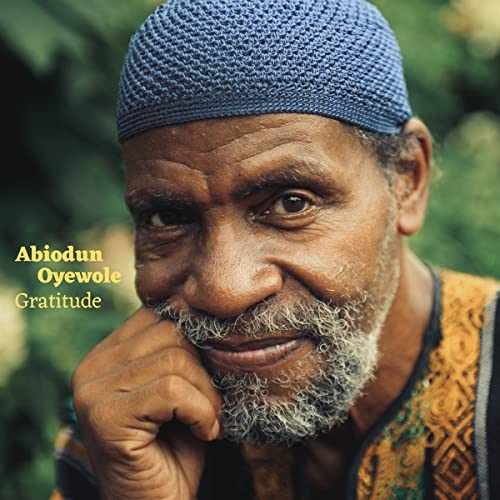 Close-up of Abiodun Oyewole, a Black man with a beard and cap.