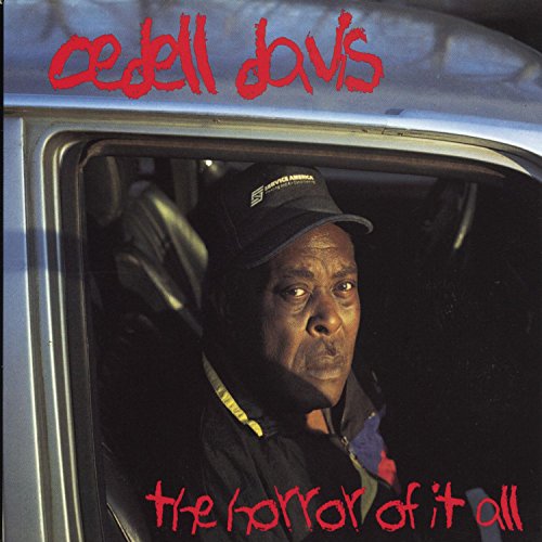 Album cover for "Horror of It All" by Cedell Davis, showing a man in a car.