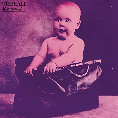 Album cover for “Reconciled” featuring a baby with a suitcase.