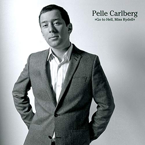 Black and white portrait of a man in a suit, CD cover.