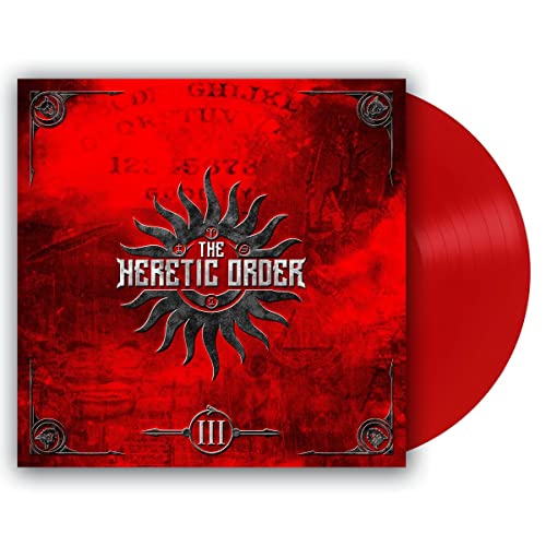 Red vinyl record with a dark, ornate cover featuring a sun symbol.