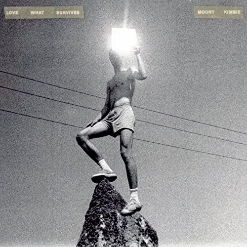 Black and white album cover featuring a person with a glowing head.