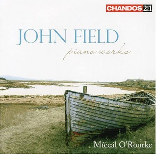 CD case featuring piano keys and text: Miceal O'Rourke - FIELD JOHN.