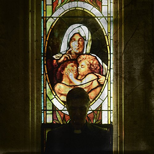 Stained glass image with a figure and cherubs, shadowed by a person.