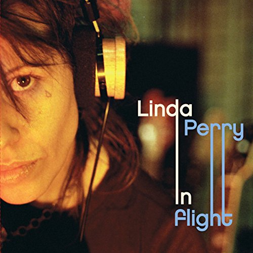 Linda Perry album cover, “In Flight”, featuring a woman with headphones.