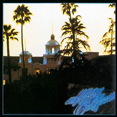 Hotel California album cover with palm trees and a building at sunset.