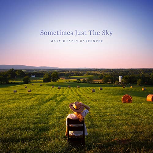 CD cover: woman in field looking at distant landscape.