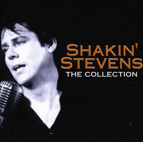 Black and white portrait of Shakin' Stevens singing into a vintage microphone.