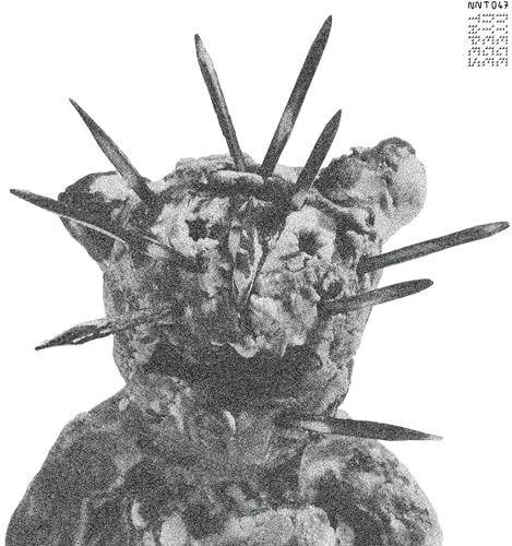 Black and white vinyl record cover with a spiky, textured figure.