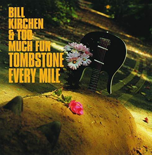 Album cover with guitar and flowers on a dirt mound.