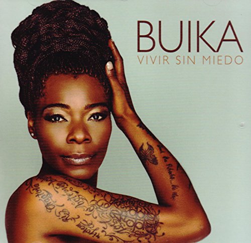 Buika album cover: portrait of a dark-skinned woman with intricate tattoos.