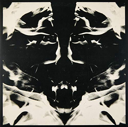 Black and white album cover with a distorted, symmetrical face.