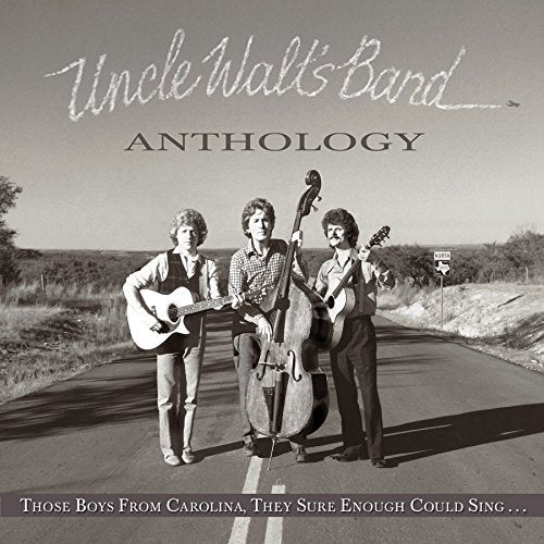 CD cover featuring three musicians with instruments on a rural road.