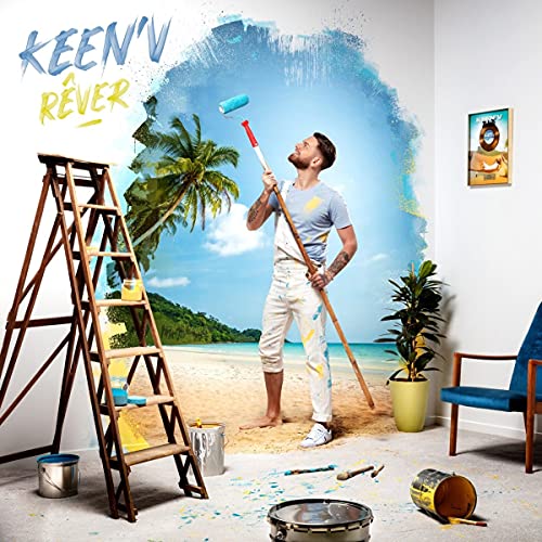 Man painting a tropical beach scene onto a wall with a roller.
