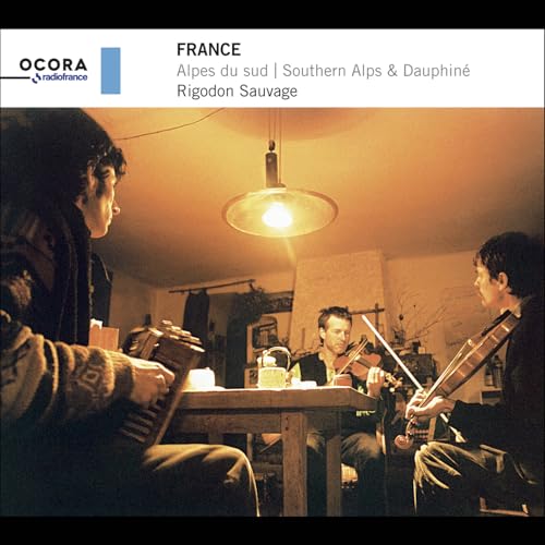 CD cover featuring musicians playing accordion and violin in a rustic room.