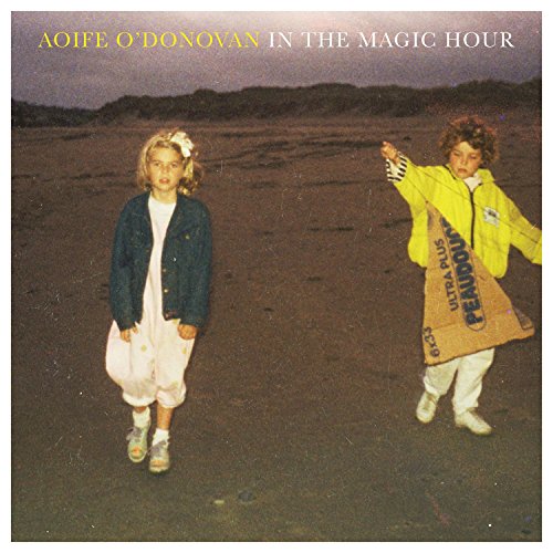 CD cover: two young children walking on a sandy beach.