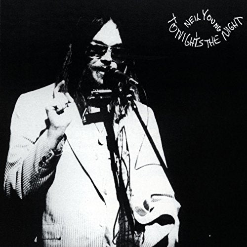 Black and white album cover featuring Neil Young performing with a microphone.
