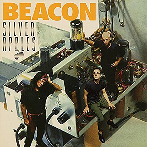 Album cover for Silver Applesā āBeaconā featuring two men and electronic equipment.