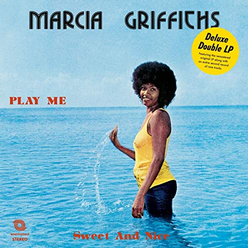 Marcia Griffiths album cover, woman in water, blue ocean background.