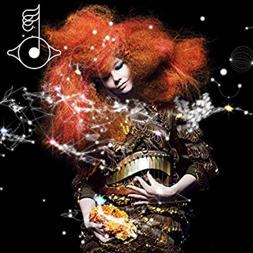 Woman with red hair and gold dress against black background with white sparkles.
