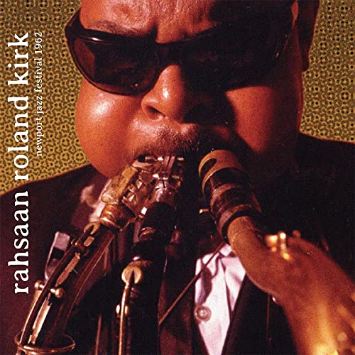 Rahsaan Roland Kirk playing multiple saxophones, album cover close-up.