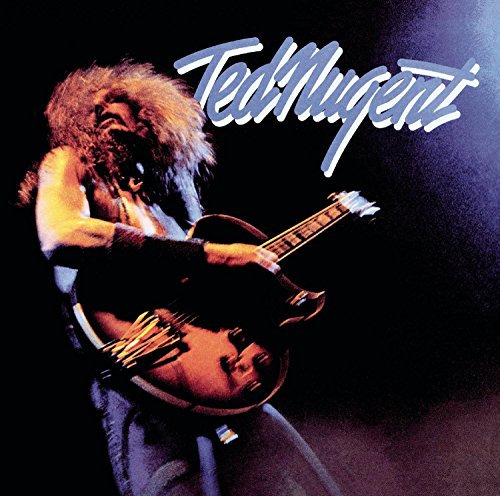 Ted Nugent playing an electric guitar on stage with the artist name written above.