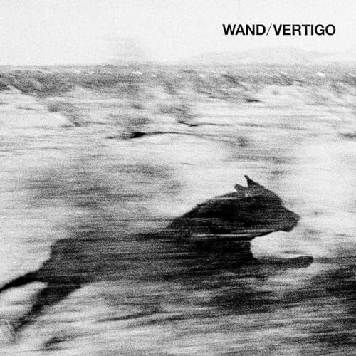 Black and white album cover featuring a blurred image of a dog running.