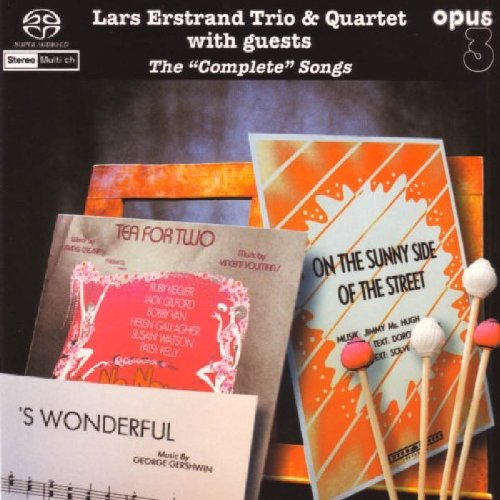 CD cover featuring colorful artwork of sheet music and drumsticks.