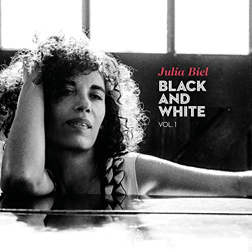 Black and white CD cover featuring Julia Biel with curly hair.