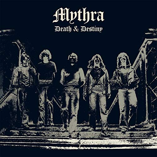 Black and white album cover featuring a band standing before a gate.