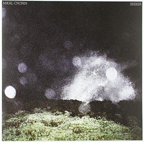 Mikal Cronin’s “Seeker” vinyl album cover: dark landscape with glowing orbs.