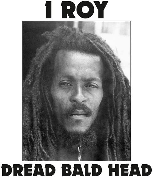 Black and white portrait of I-Roy with long dreadlocks.